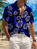 New Men'S Casual Short-Sleeve Shirt with a Blue-Black Base And White-Blue Floral Patterns. It Features an Elegant Exotic Feel, Suitable for Holiday Gatherings, Commuting, And Casual Wear. Made from Machine-Washable Polyester Fabric